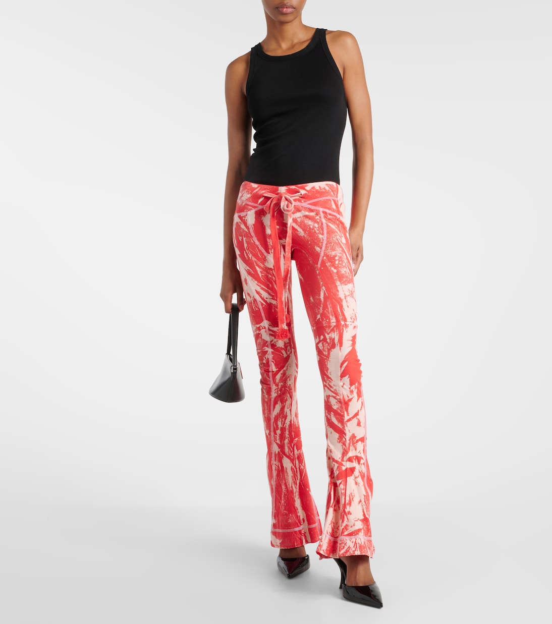 Raze low-rise tie-dye flared pants | KNWLS