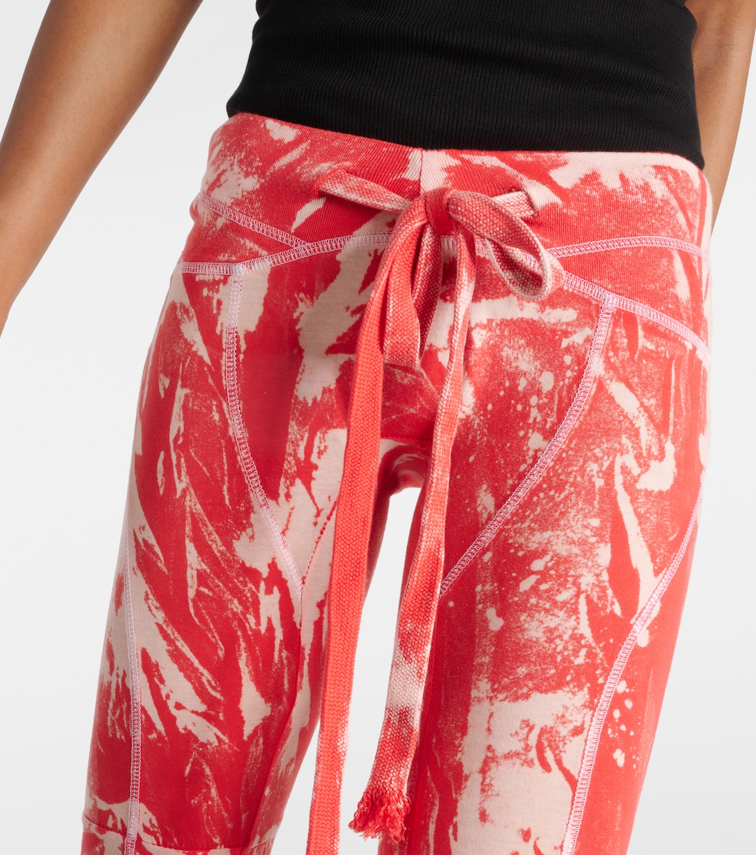 Raze low-rise tie-dye flared pants | KNWLS