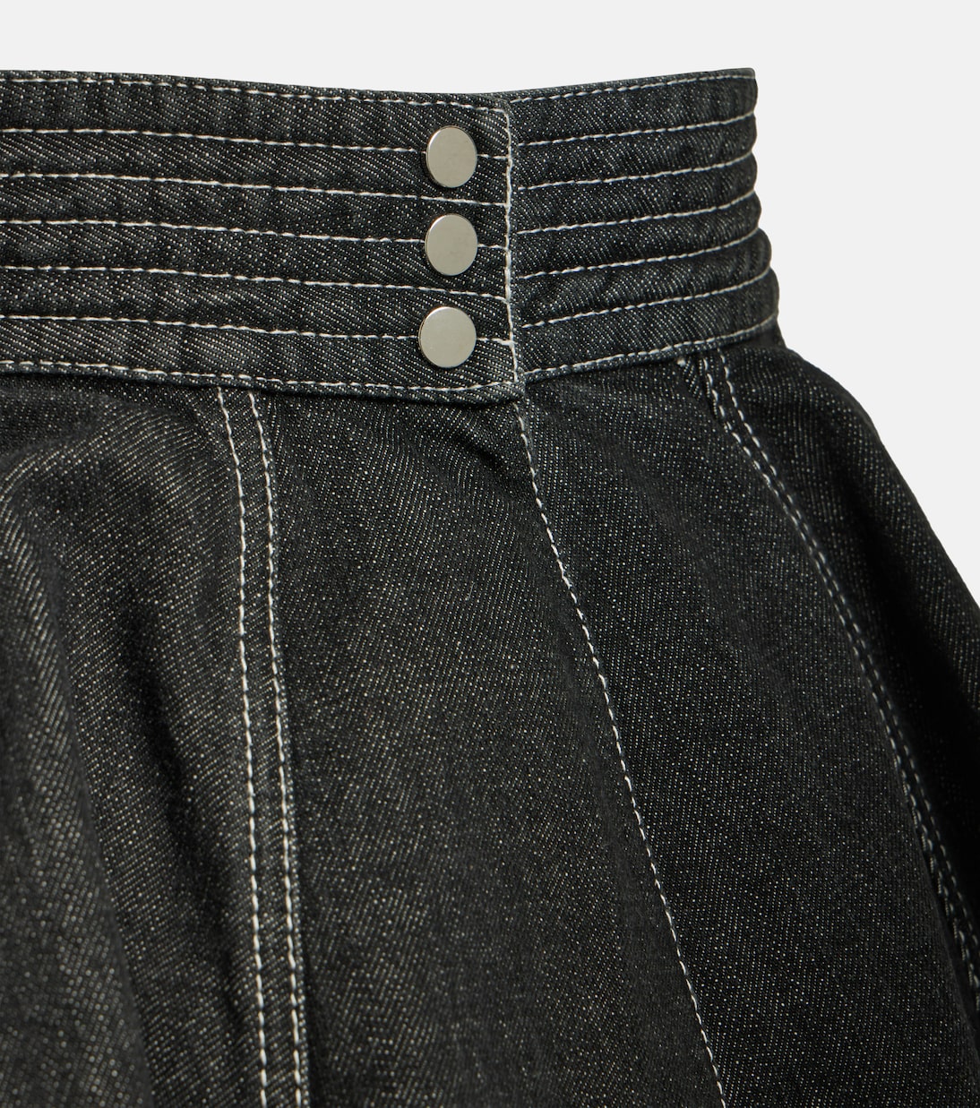 Gonna in denim ALAÏA con cintura e peplum, stile giovanile