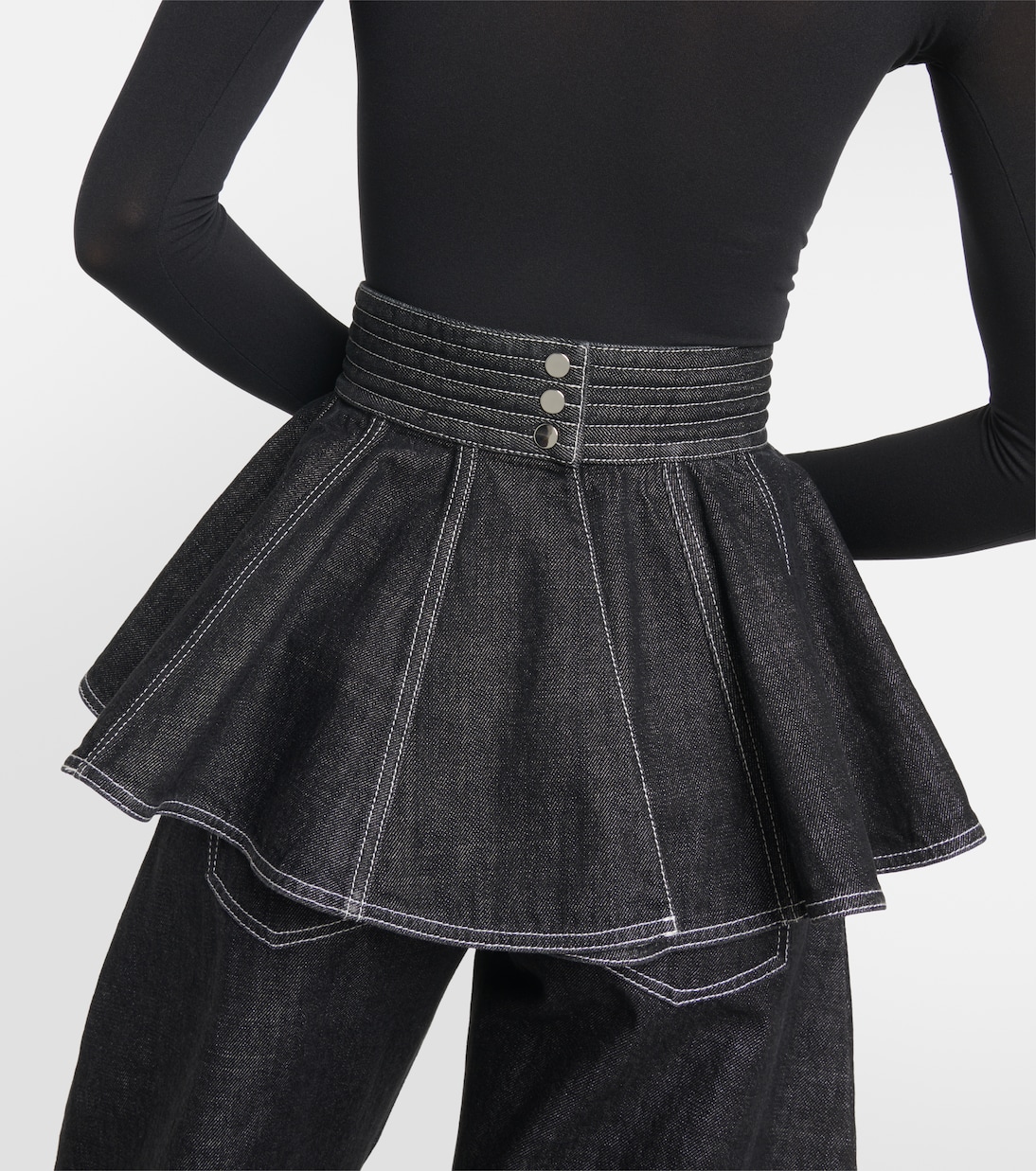 Gonna in denim ALAÏA con cintura e peplum, stile giovanile