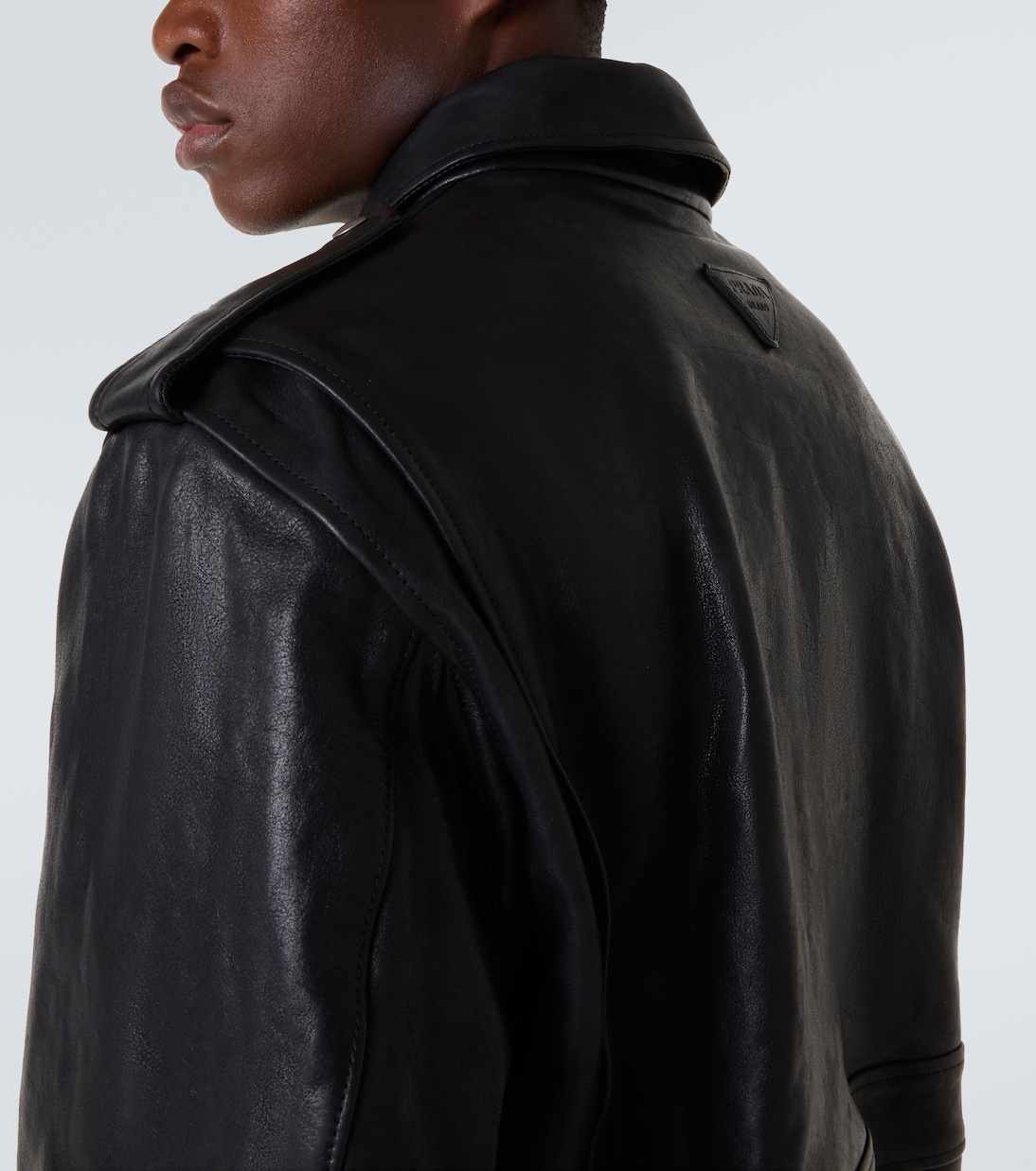 Faux fur-trimmed leather jacket | Prada