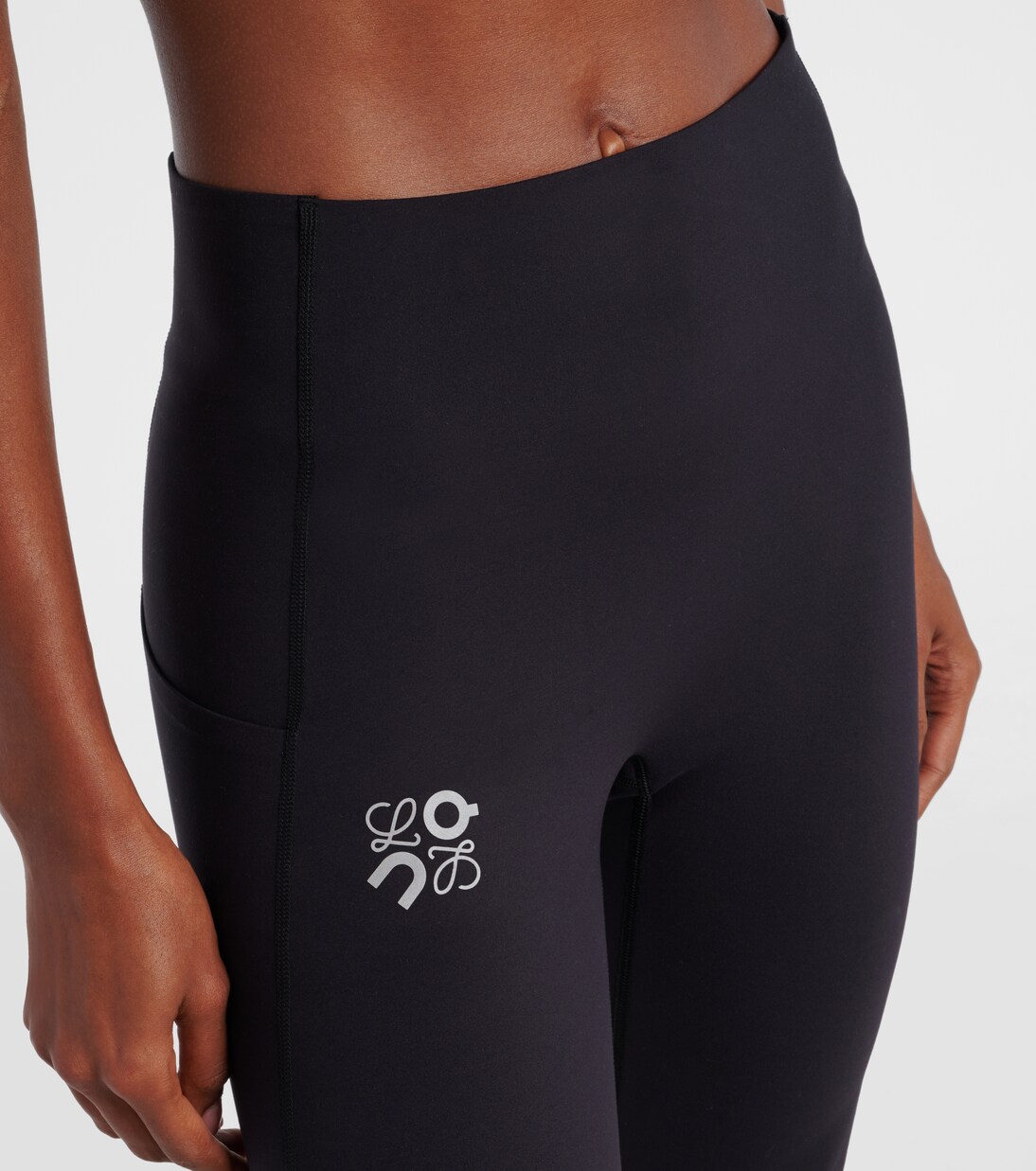 x On high-rise flared leggings | Loewe