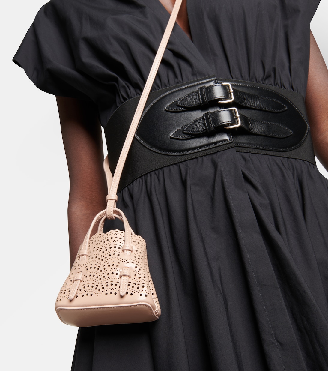 Le Mina Mini leather crossbody bag in beige Alaia Mytheresa