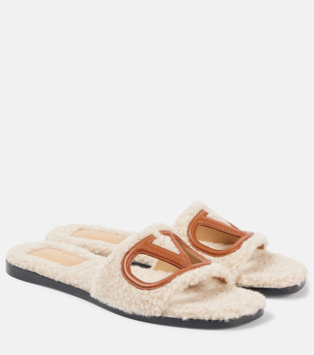 VLogo cutout faux shearling slides | Valentino Garavani