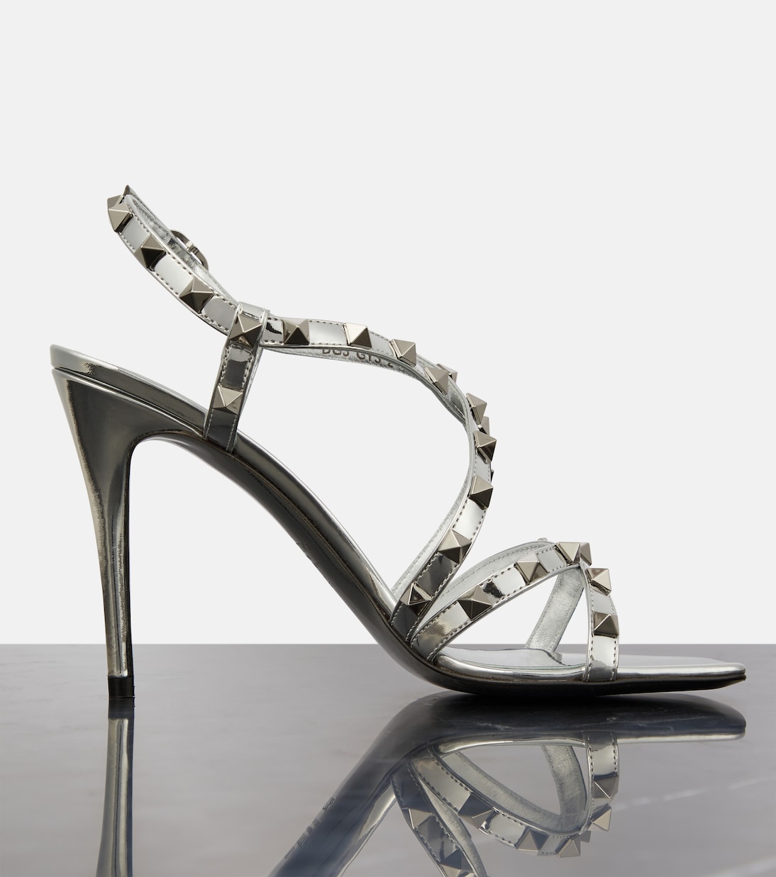 Rockstud metallic leather sandals in silver Valentino Garavani Mytheresa