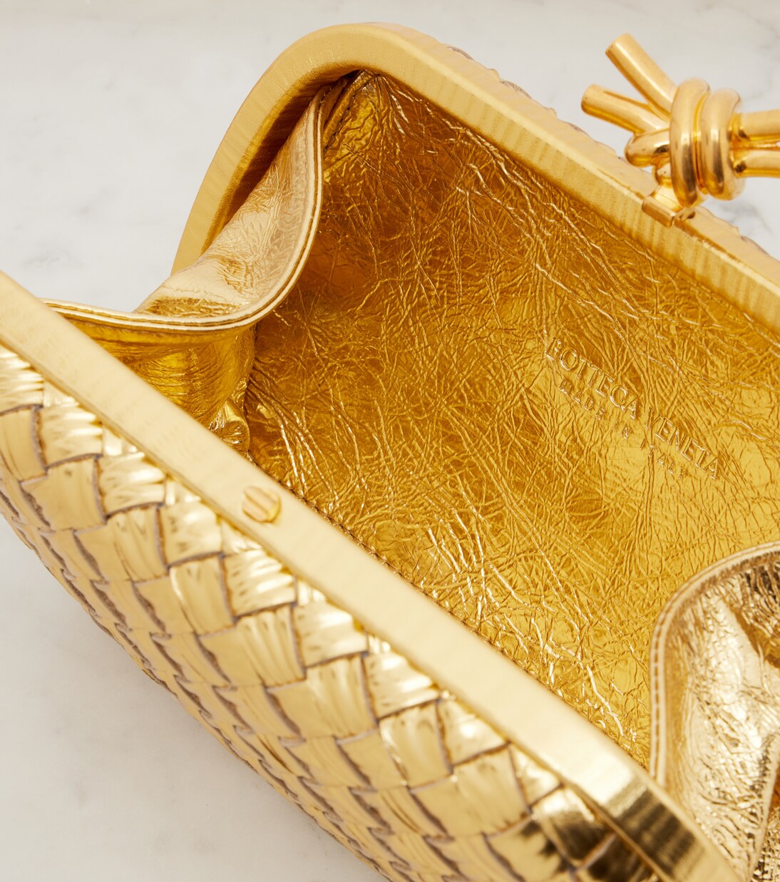 Knot Intreccio metallic leather clutch | Bottega Veneta