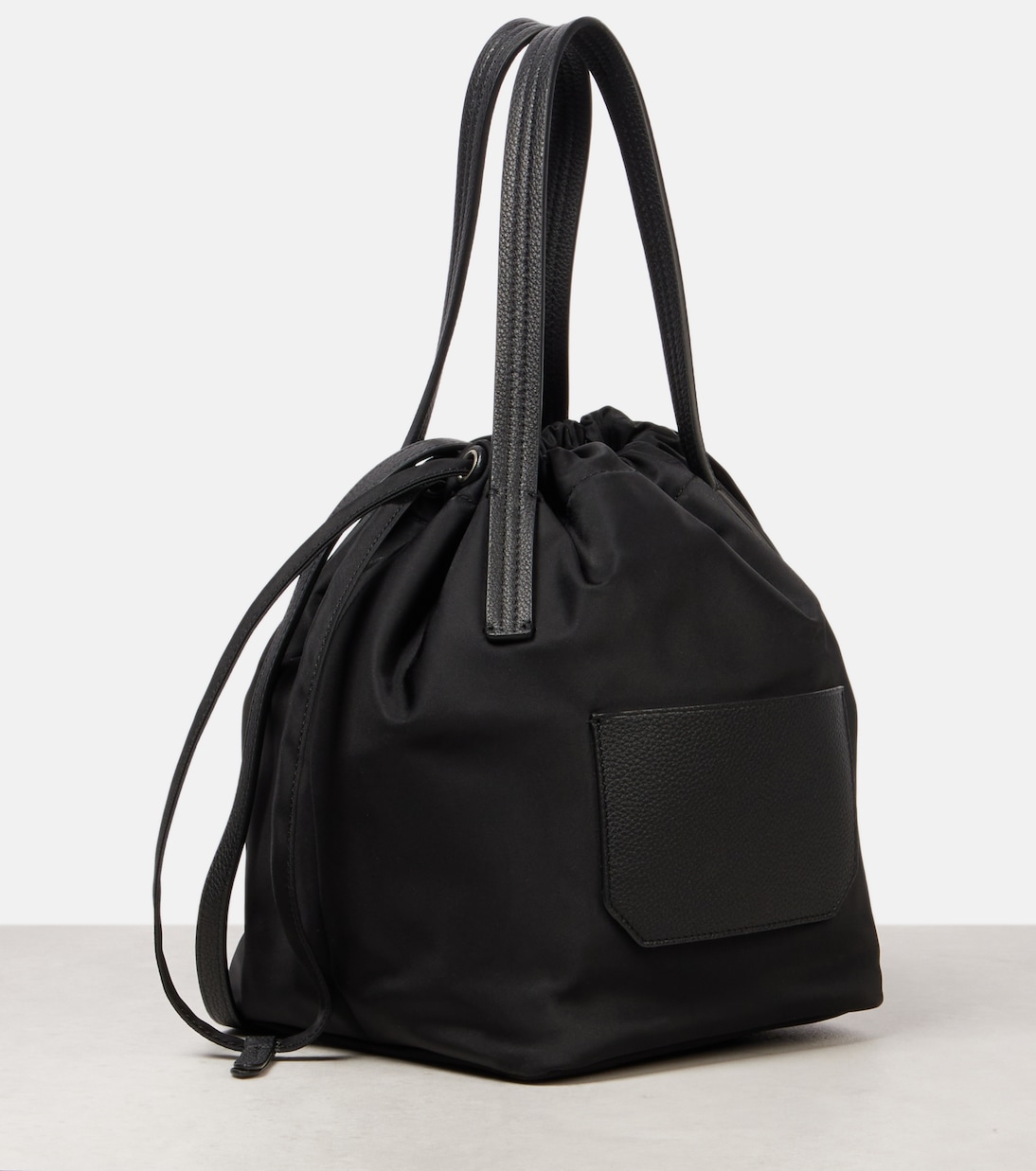 Rory Medium leather-trimmed bucket bag | Khaite