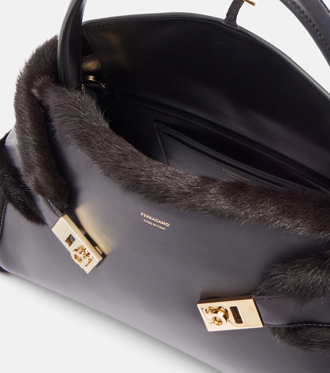 Hugh Medium shearling-trimmed leather shoulder bag | Ferragamo