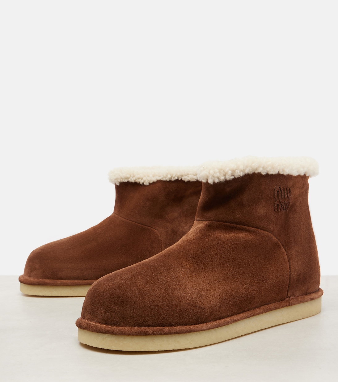 Shearling-lined suede ankle boots | Miu Miu