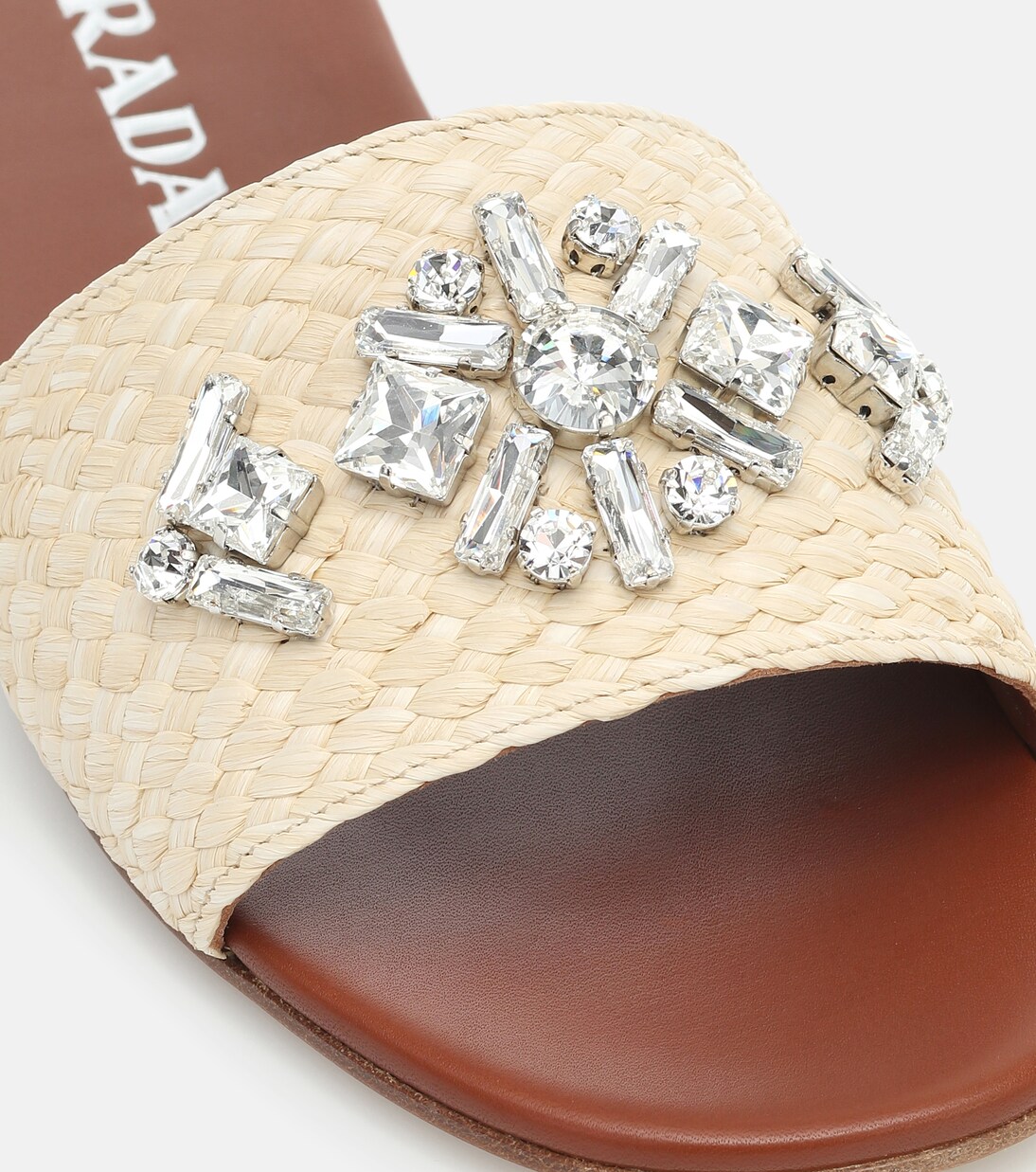 Crystal-embellished raffia slides in beige - Prada | Mytheresa