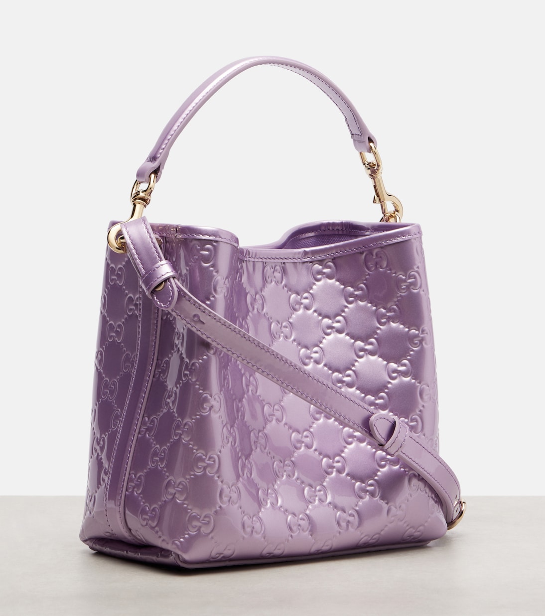 GG Emblem Medium metallic leather bucket bag | Gucci