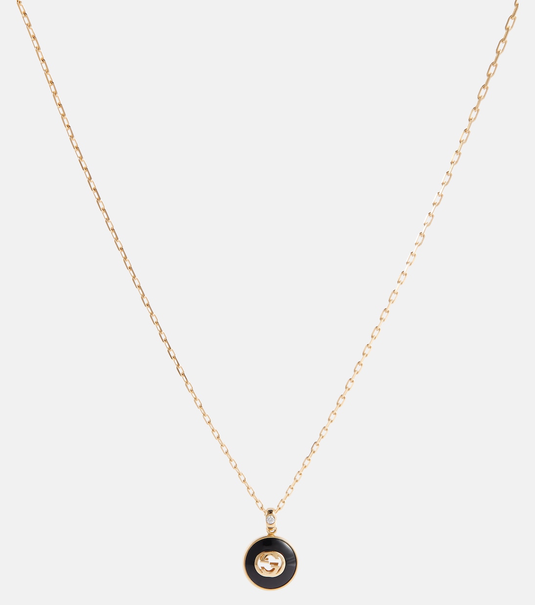 Collana GUCCI in oro 18kt con dettagli in onice e diamanti, stile giovane e iconico
