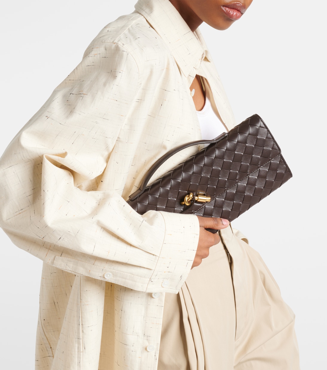 Andiamo Intrecciato leather clutch in green Bottega Veneta Mytheresa