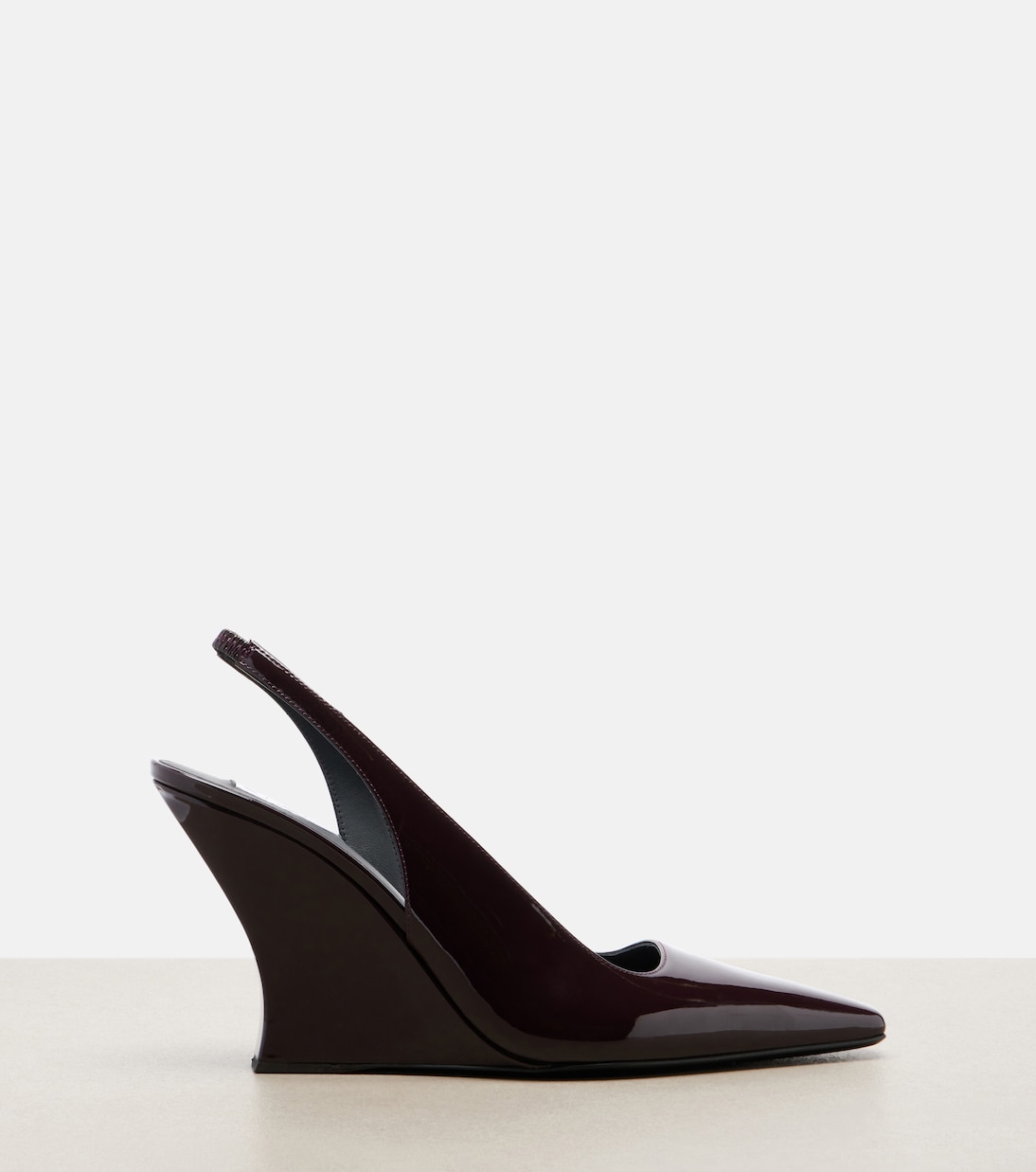 Patent leather wedge slingback pumps | Alaïa