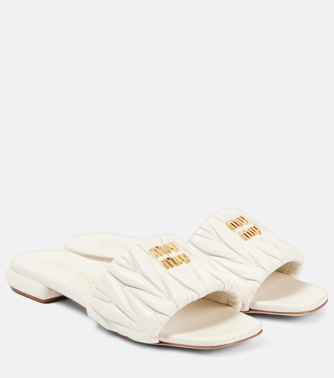 Scarpe slip-on in pelle traforata con logo MIU MIU, stile giovane e moderno