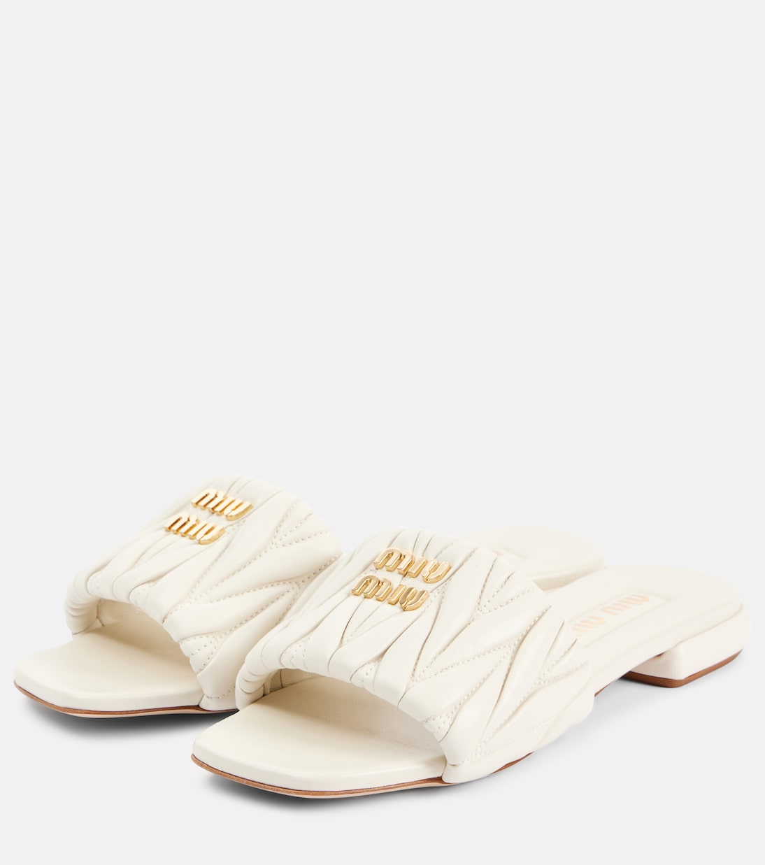 Scarpe slip-on in pelle traforata con logo MIU MIU, stile giovane e moderno