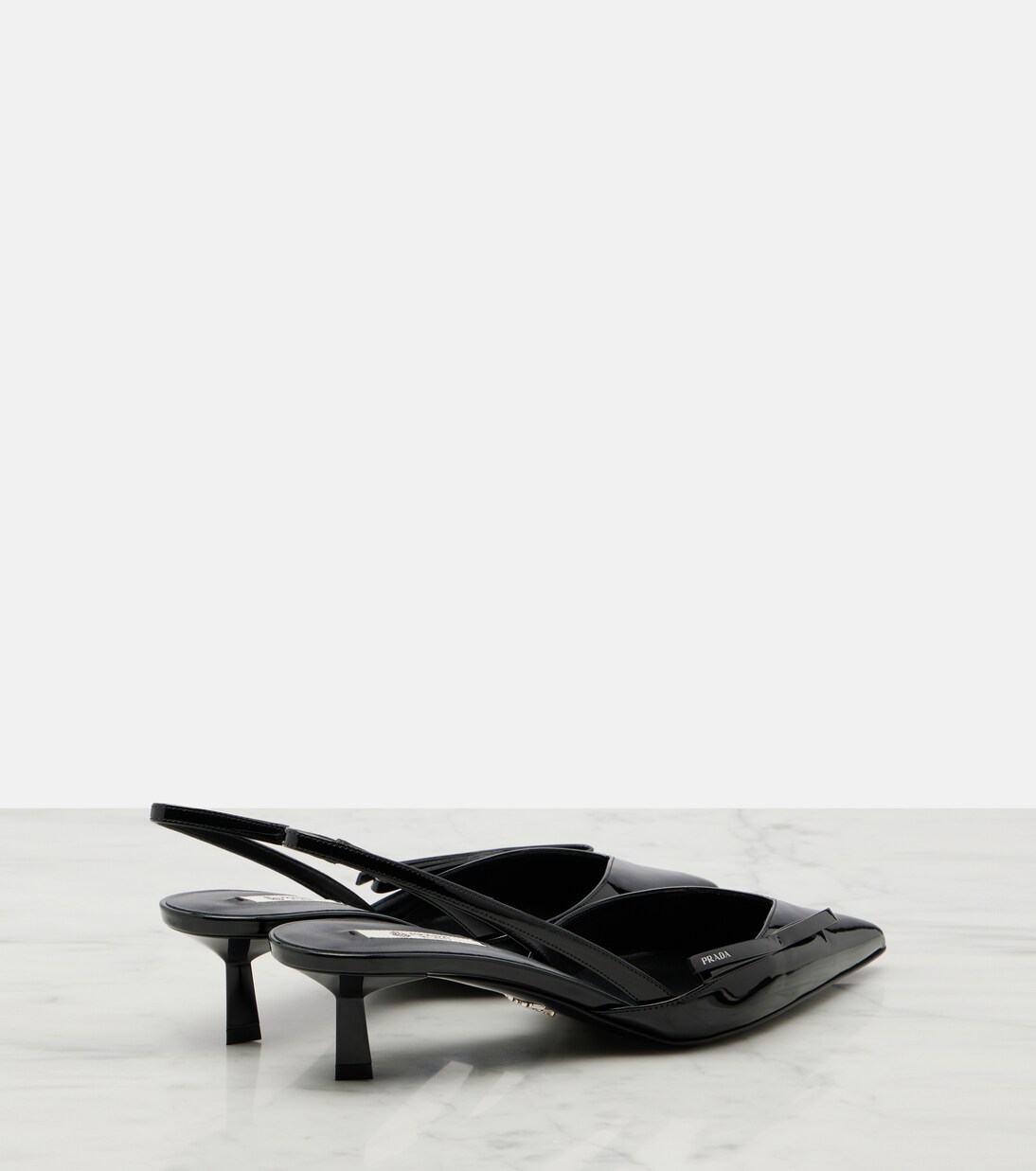 Patent leather slingback pumps | Prada