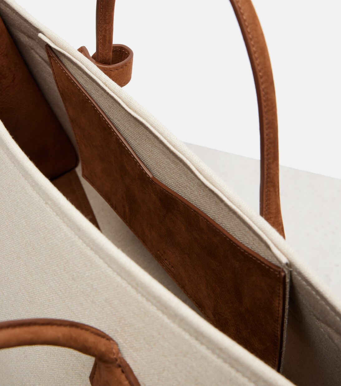 Le Teckel leather-trimmed canvas tote bag | Alaïa