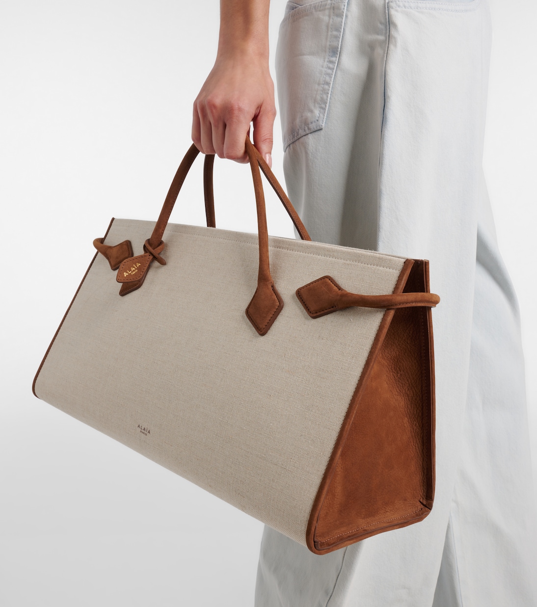 Le Teckel leather-trimmed canvas tote bag | Alaïa