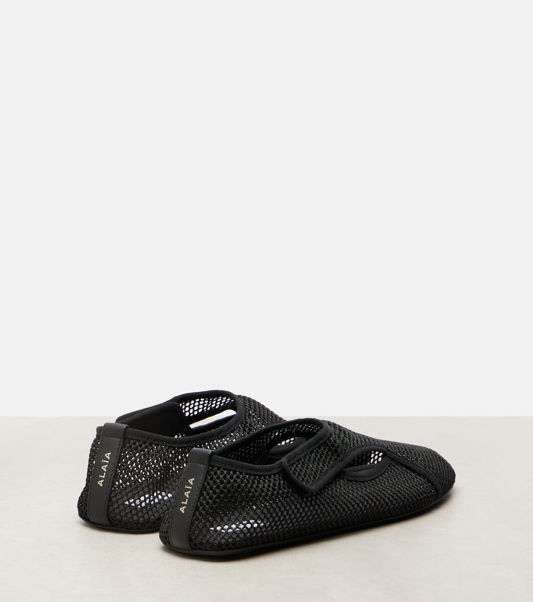 Fishnet slip-on shoes | Alaïa