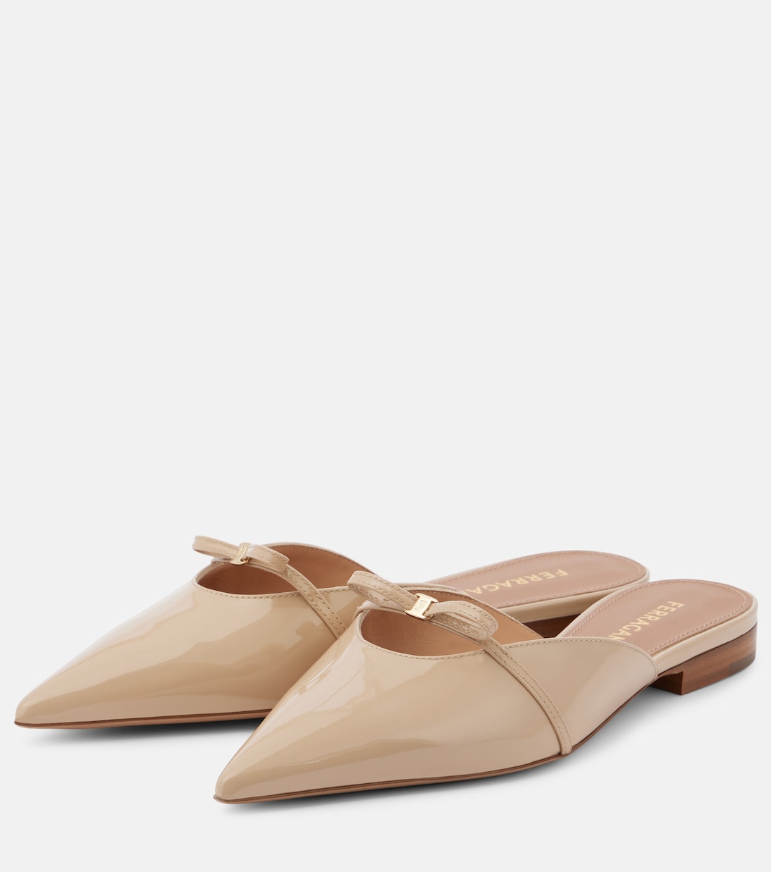 Mules in pelle laccata con dettaglio a fiocco di FERRAGAMO per giovani alla moda