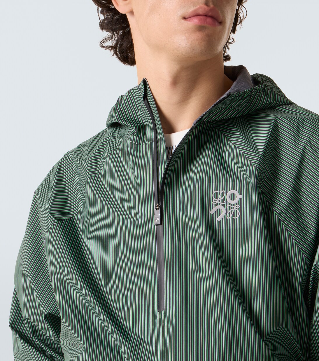 x On striped technical jacket  | Loewe