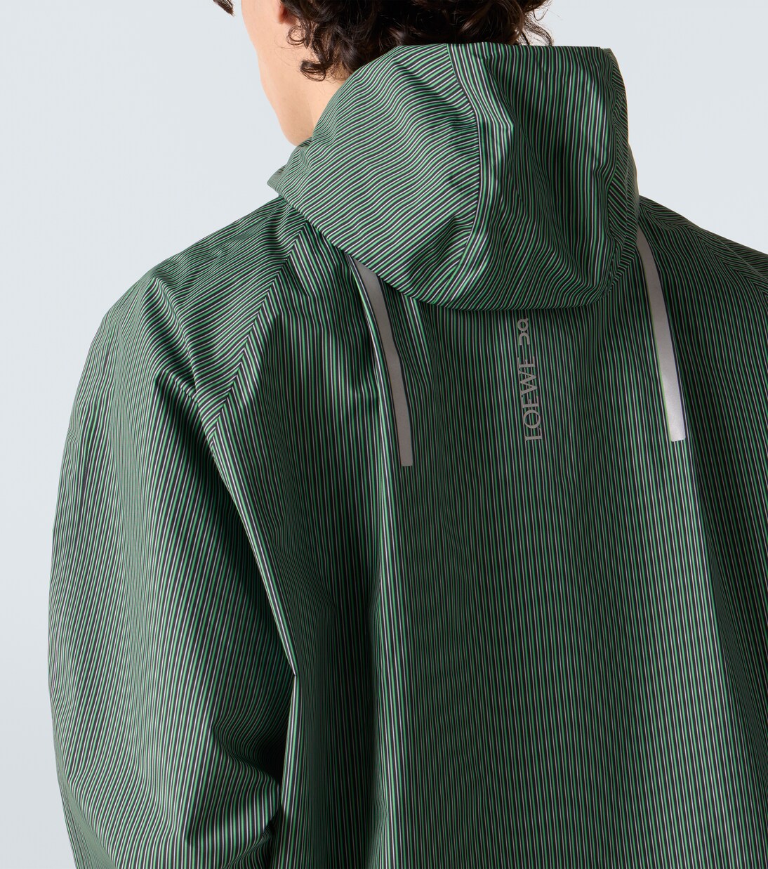 x On striped technical jacket  | Loewe