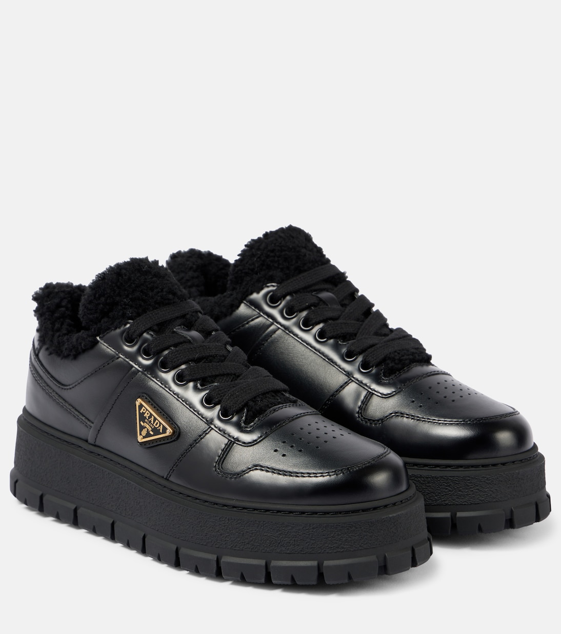 Shearling lined leather platform sneakers in black Prada Mytheresa