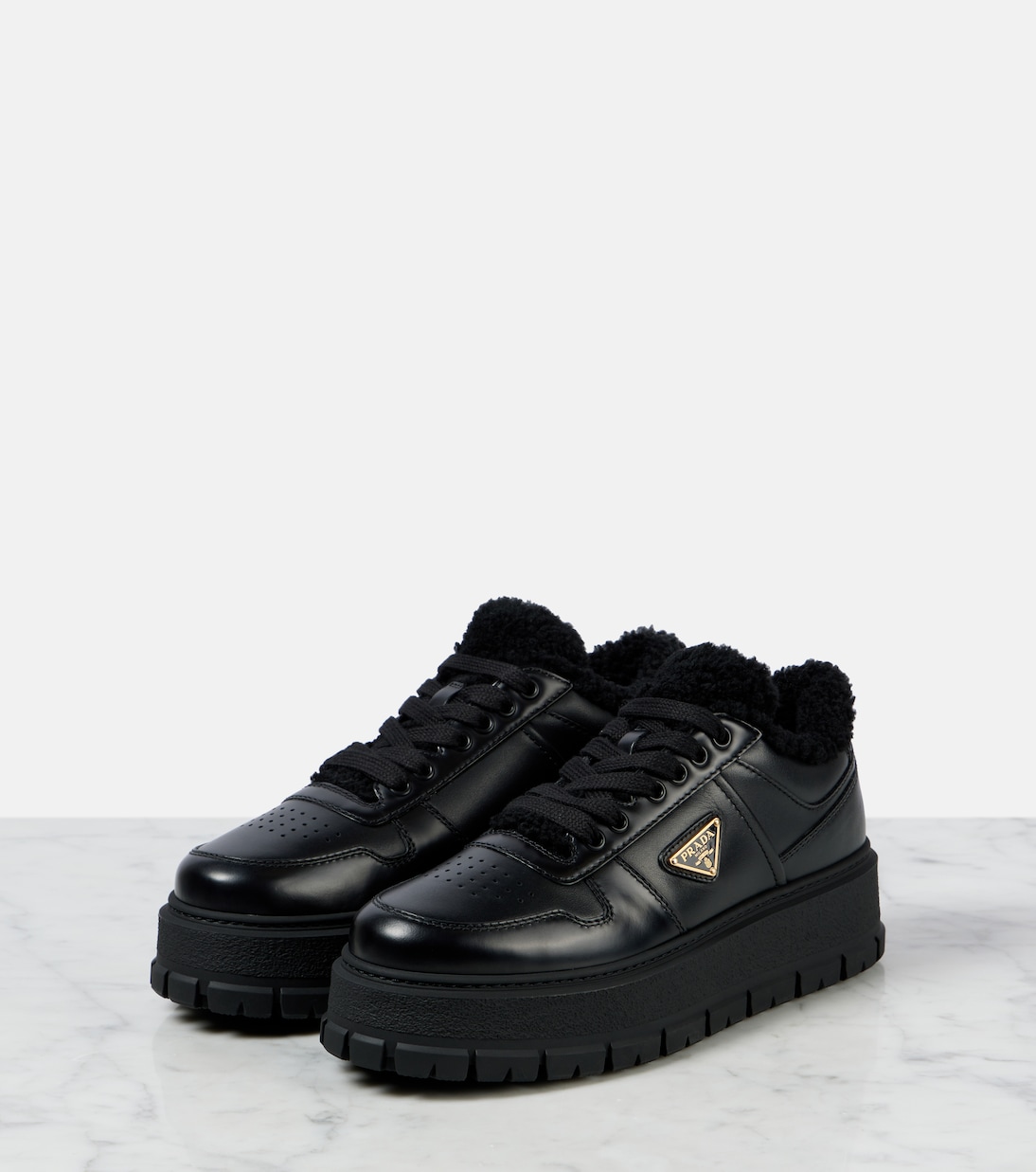 Shearling-lined leather platform sneakers | Prada
