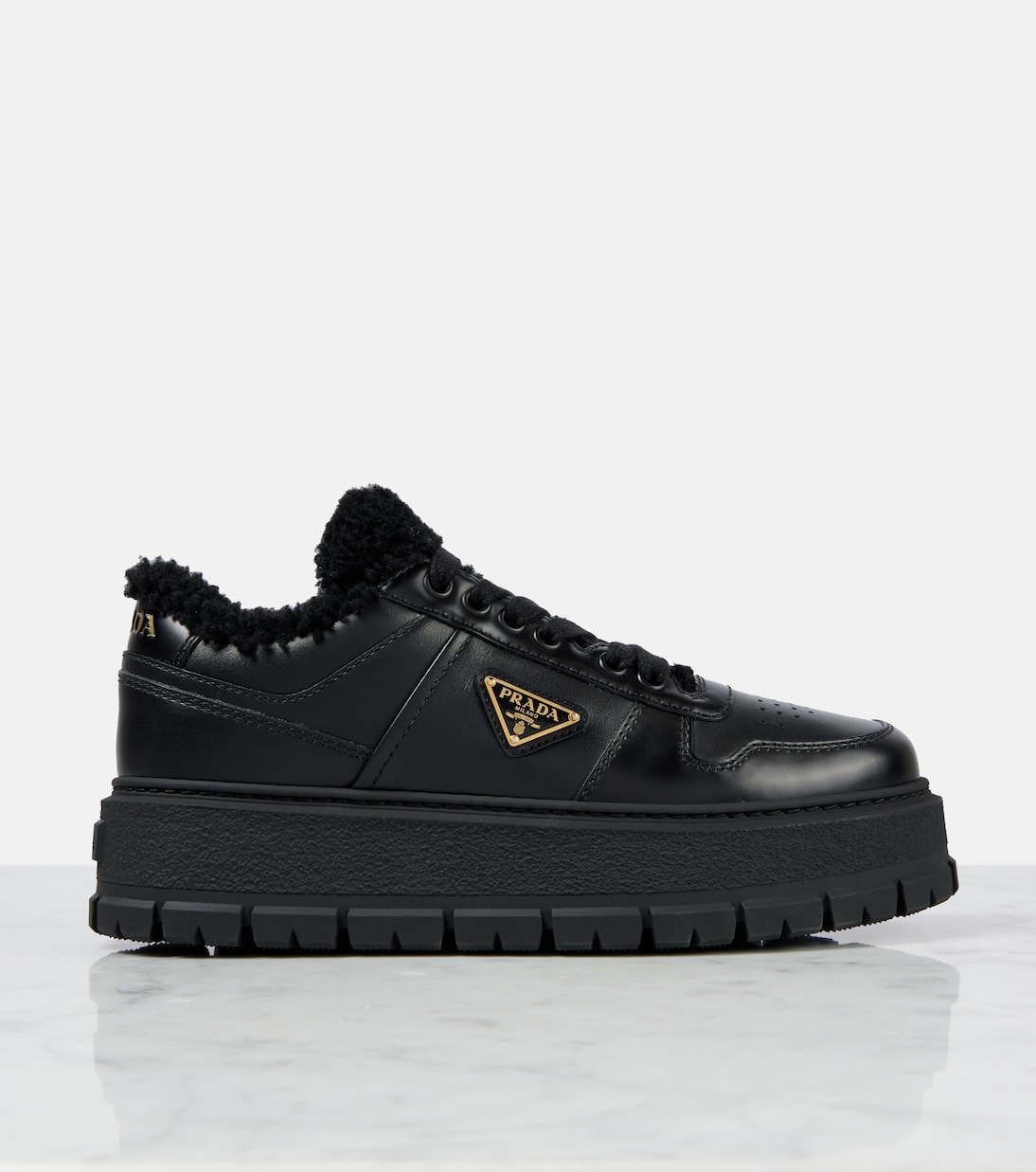 Shearling-lined leather platform sneakers | Prada