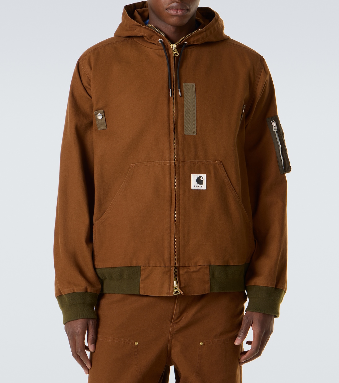 x Carhatt جاكيت بافر من القطن بغطاء للرأس | Sacai
