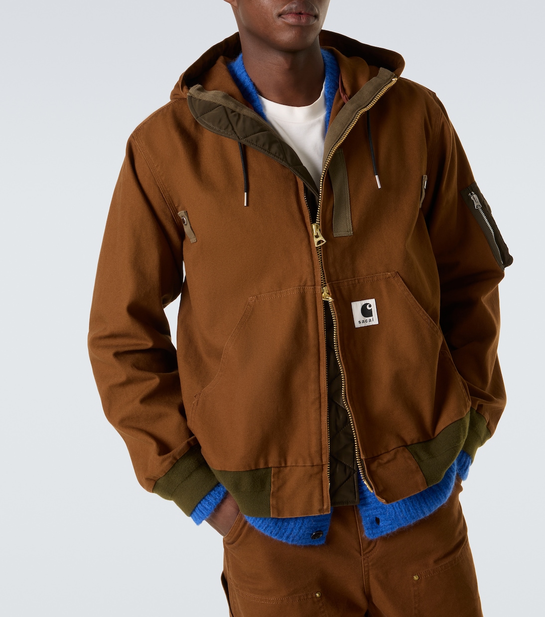 x Carhatt جاكيت بافر من القطن بغطاء للرأس | Sacai