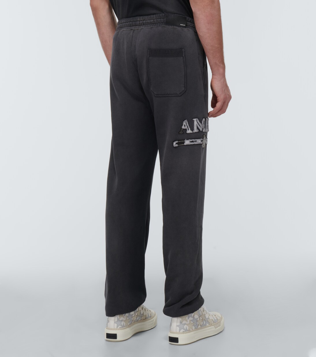 Logo cotton sweatpants in black - Amiri | Mytheresa