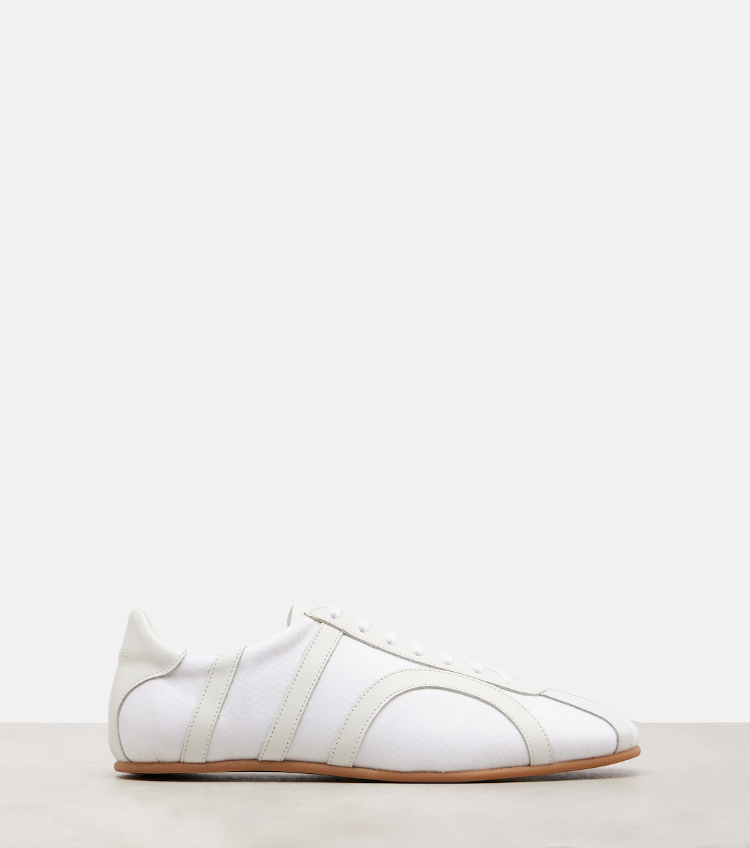 Leather-trimmed sneakers | Toteme