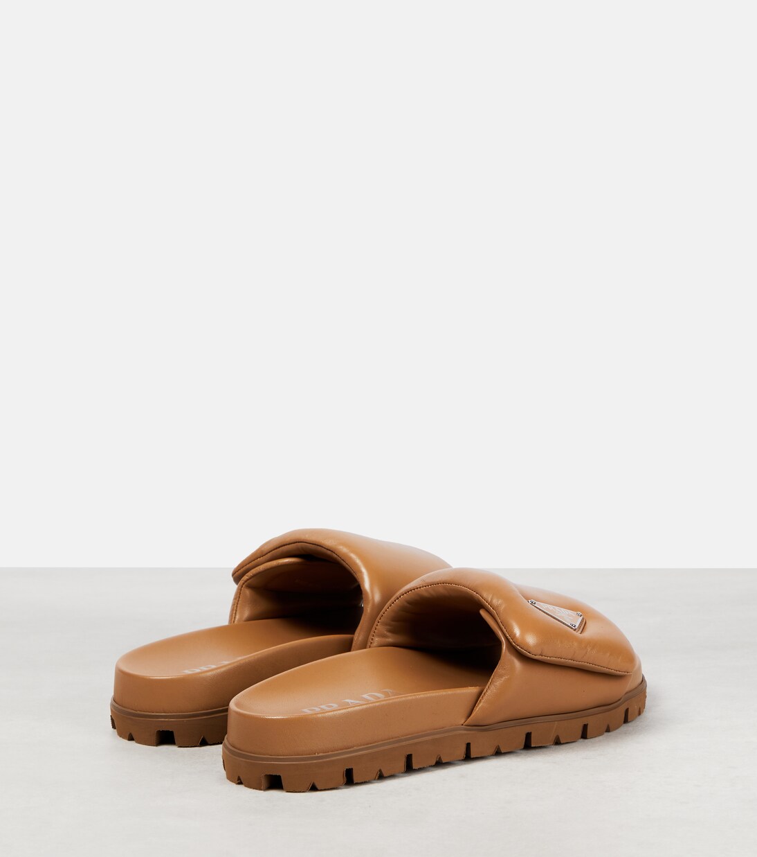 Padded nappa leather sandals in brown - Prada | Mytheresa