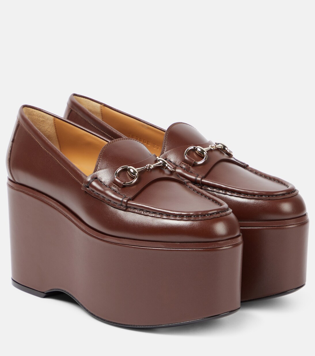 Horsebit leather platform loafers in brown Gucci Mytheresa