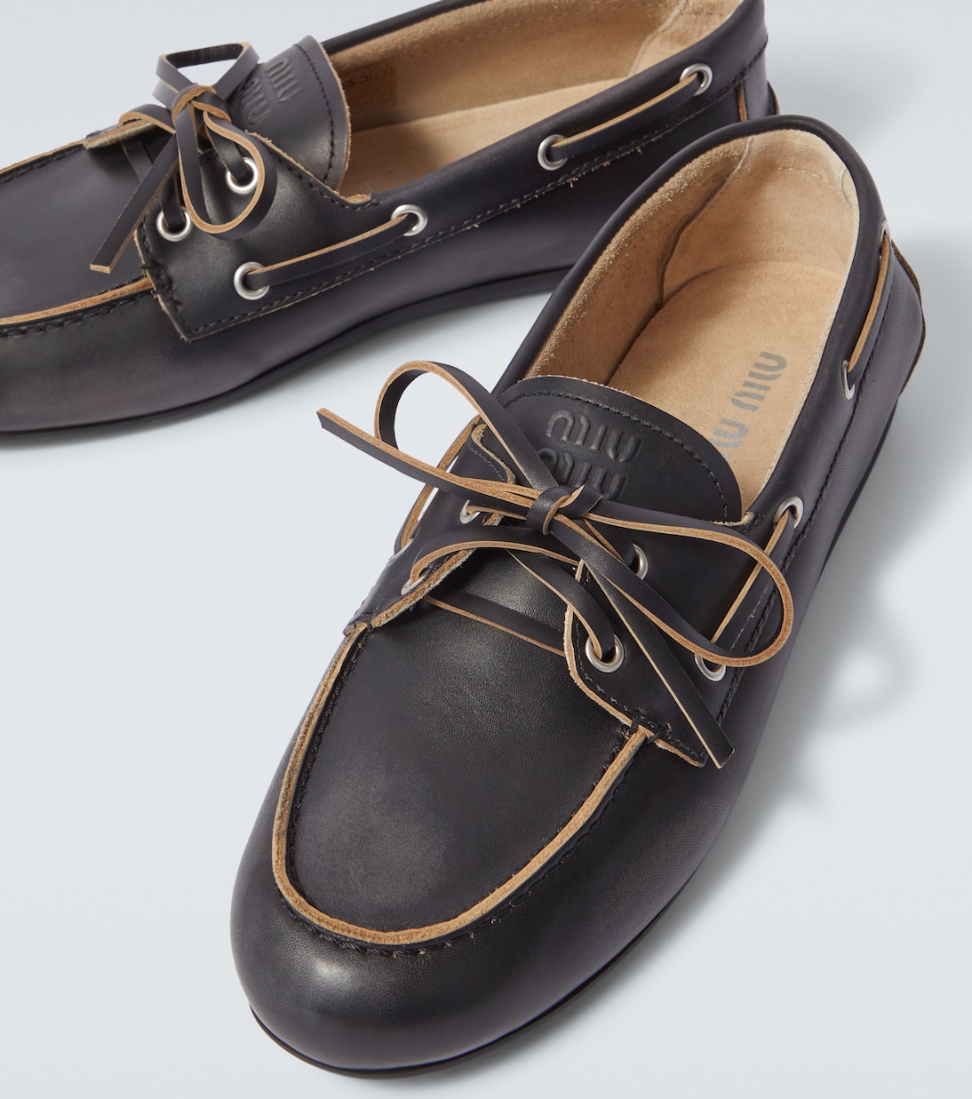 Logo leather boat shoes | Miu Miu