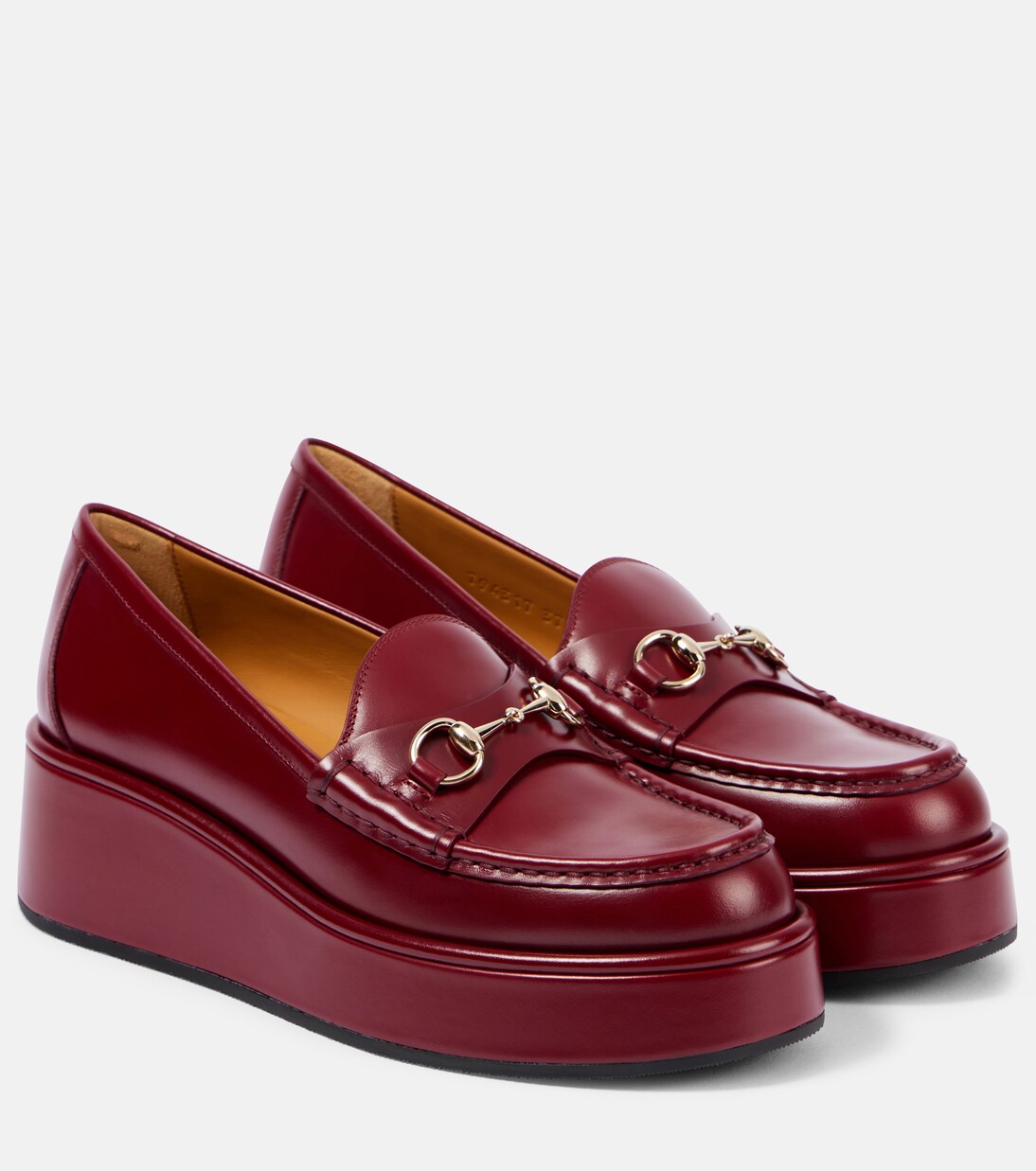Horsebit leather platform loafers in red Gucci Mytheresa