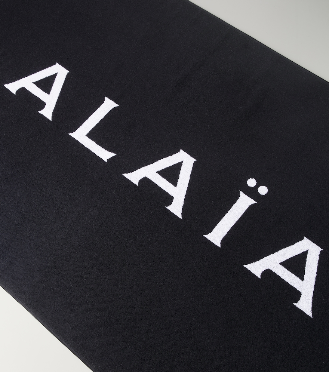Telo mare in cotone con logo | Alaïa