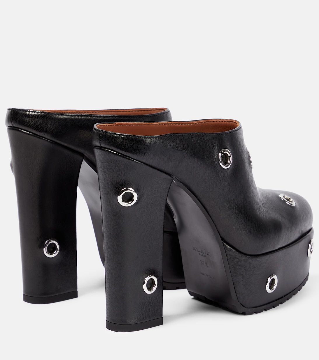 Mules à plateau en cuir à ornements | Alaïa