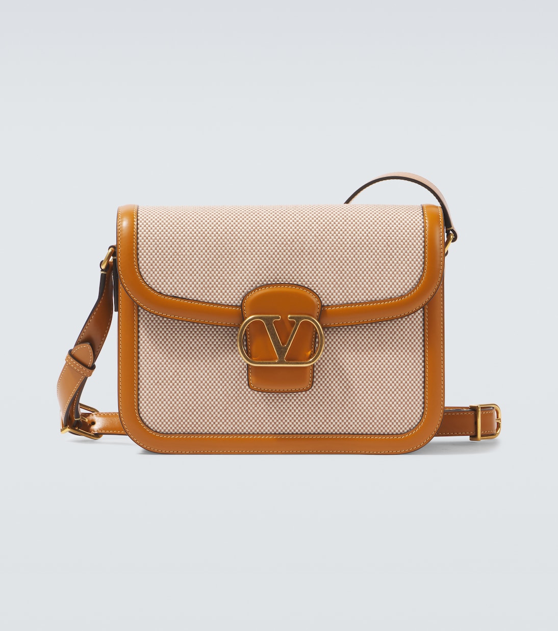 9TO5 leather-trimmed canvas shoulder bag | Valentino Garavani