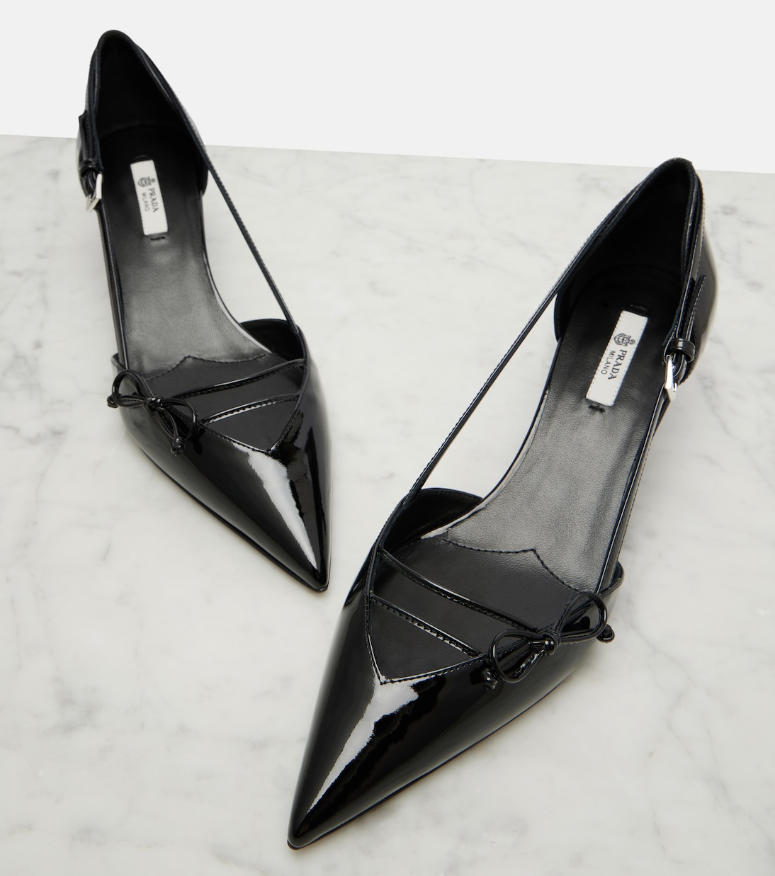 Bow-detail patent leather pumps | Prada