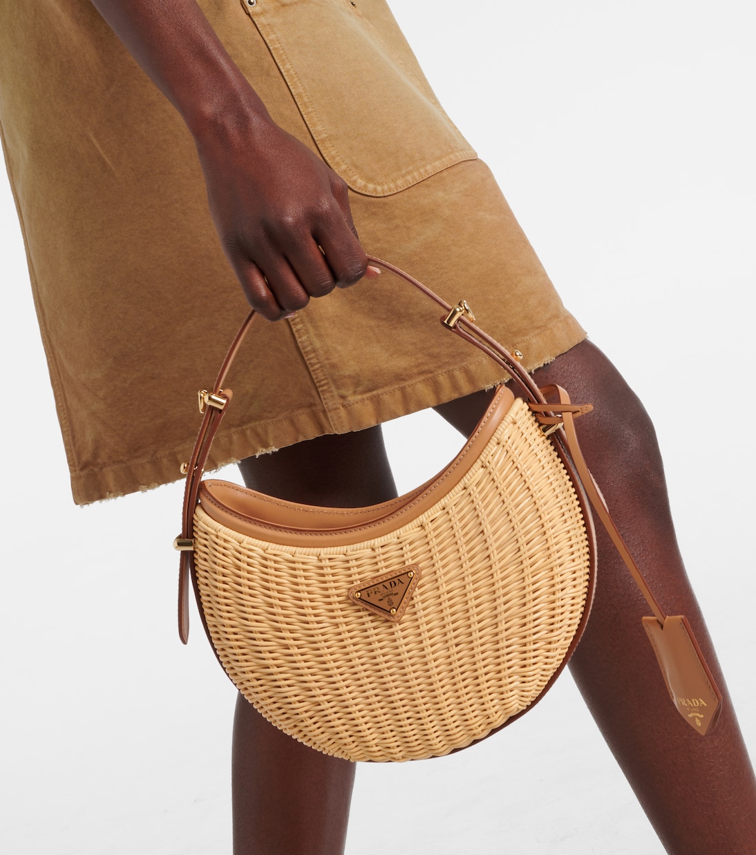 Arqué woven leather-trimmed shoulder bag | Prada