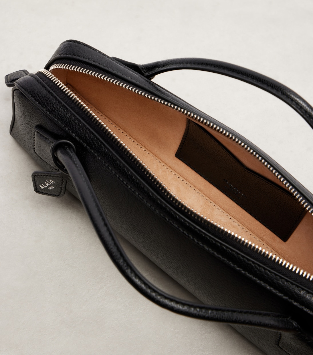 Le Teckel Small leather clutch | Alaïa