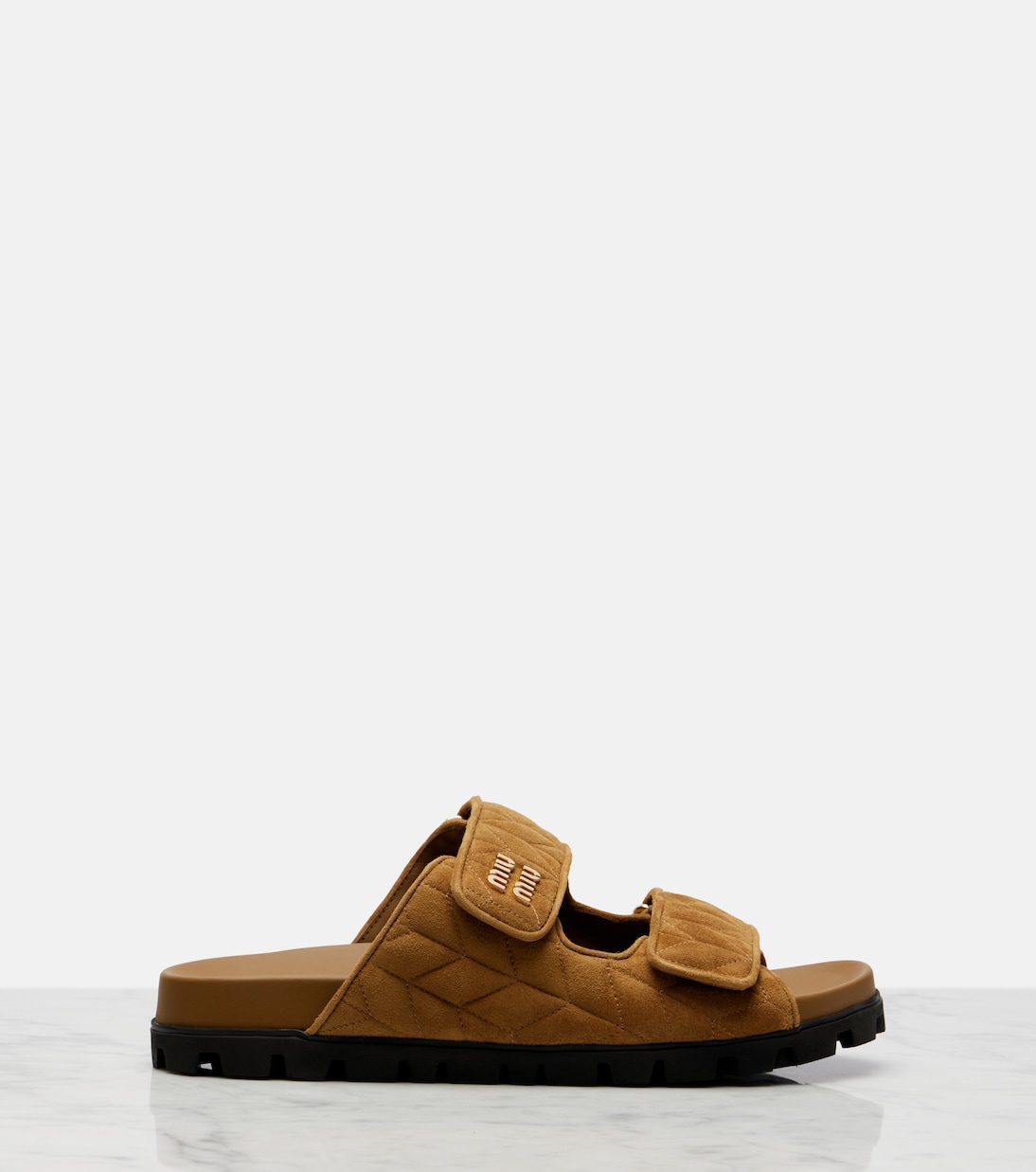 Quilted suede slides | Miu Miu