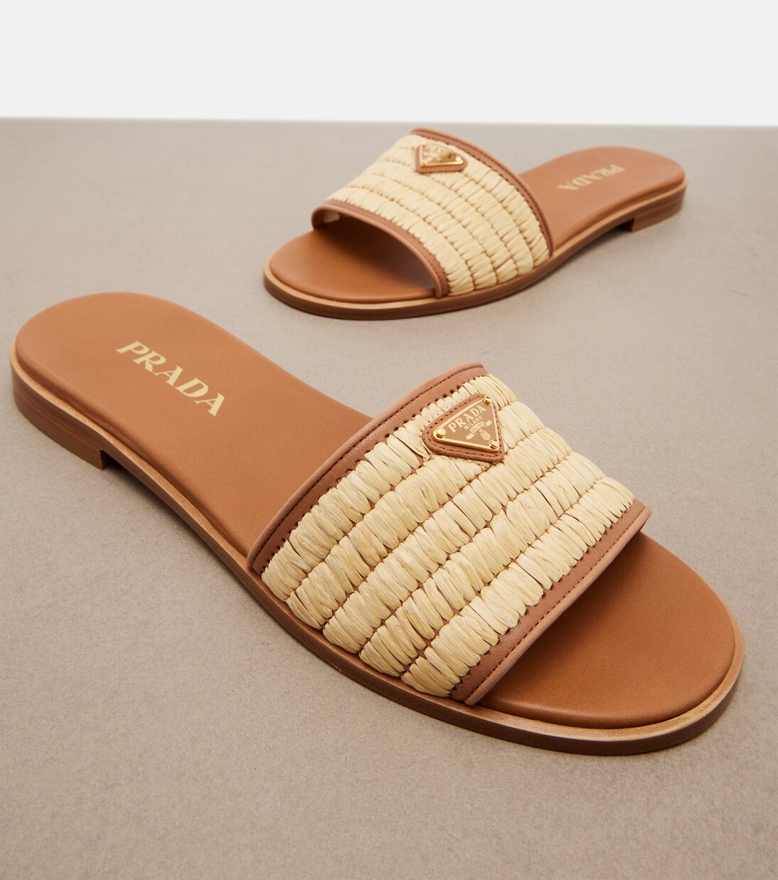 Leather-trimmed raffia sandals | Prada