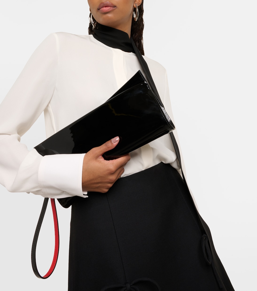 Pochette Loubitwist en cuir verni | Christian Louboutin
