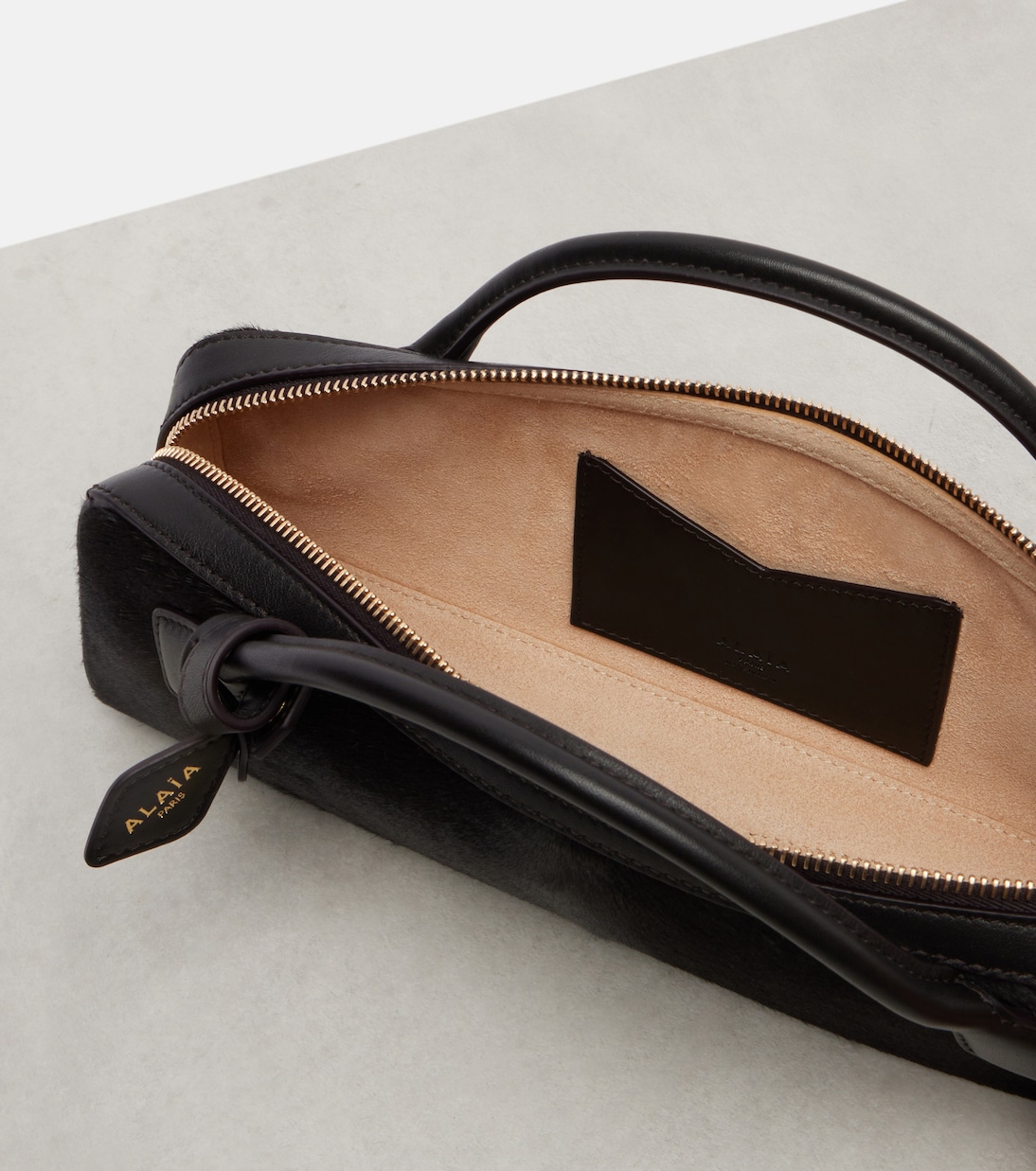Le Teckel Small calf hair clutch | Alaïa