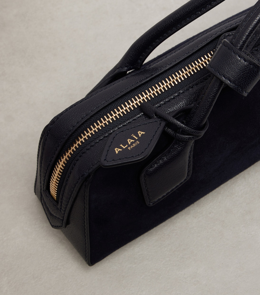 Le Teckel Small calf hair clutch | Alaïa