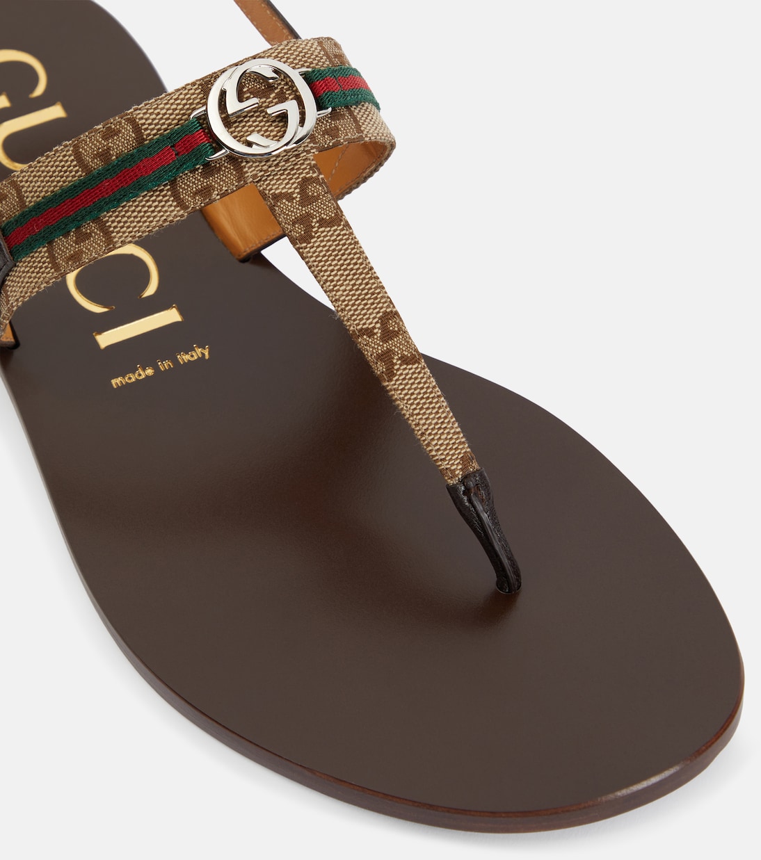 Leather trimmed thong sandals in beige Gucci Mytheresa